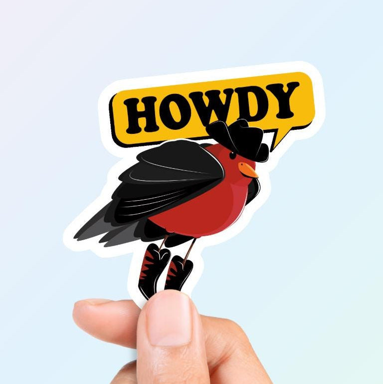 A sticker depicting a bird with a cowboy hat and a 'HOWDY' text sign in a die-cut shape, held between fingers against a light background.